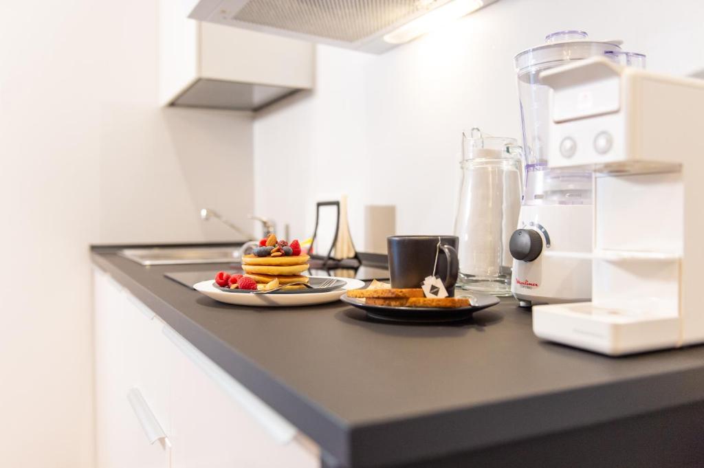 Kuchyň nebo kuchyňský kout v ubytování Smart & Urban Suites - Corso51