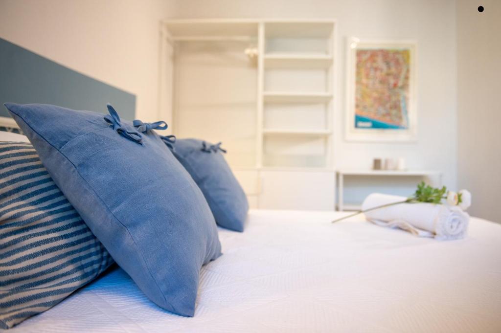 Postel nebo postele na pokoji v ubytování Smart & Urban Suites - Corso51