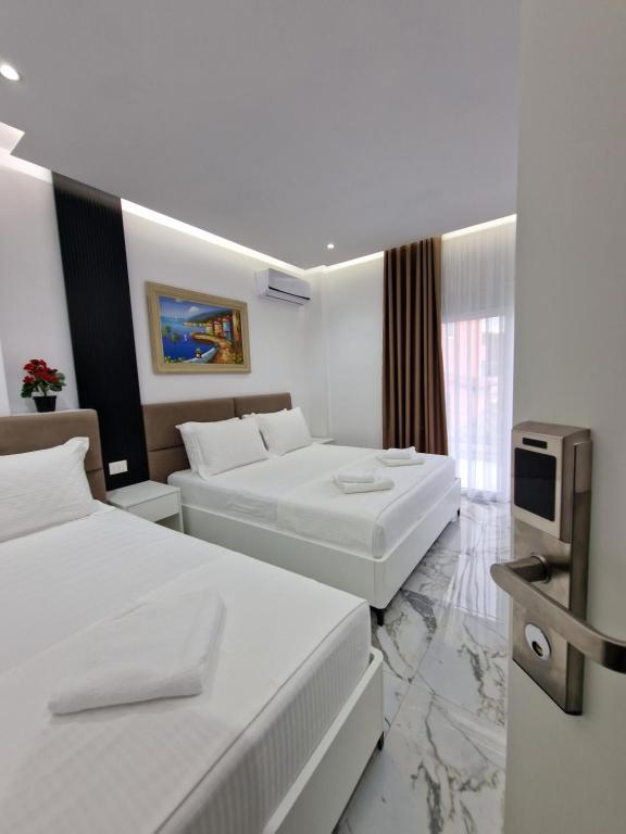 A bed or beds in a room at Apartments Margarita