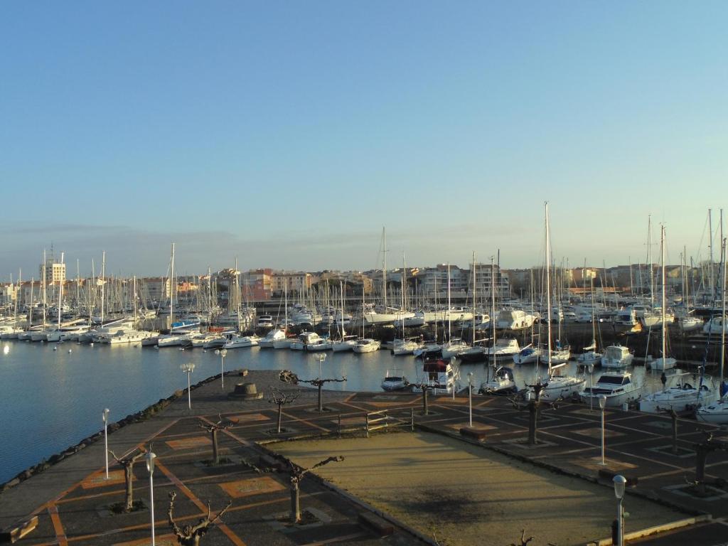 a marina with lots of boats in the water at Vue Mer 180° Parking+Lave-Linge+Proche Plages+Piscine in Cap d&#39;Agde
