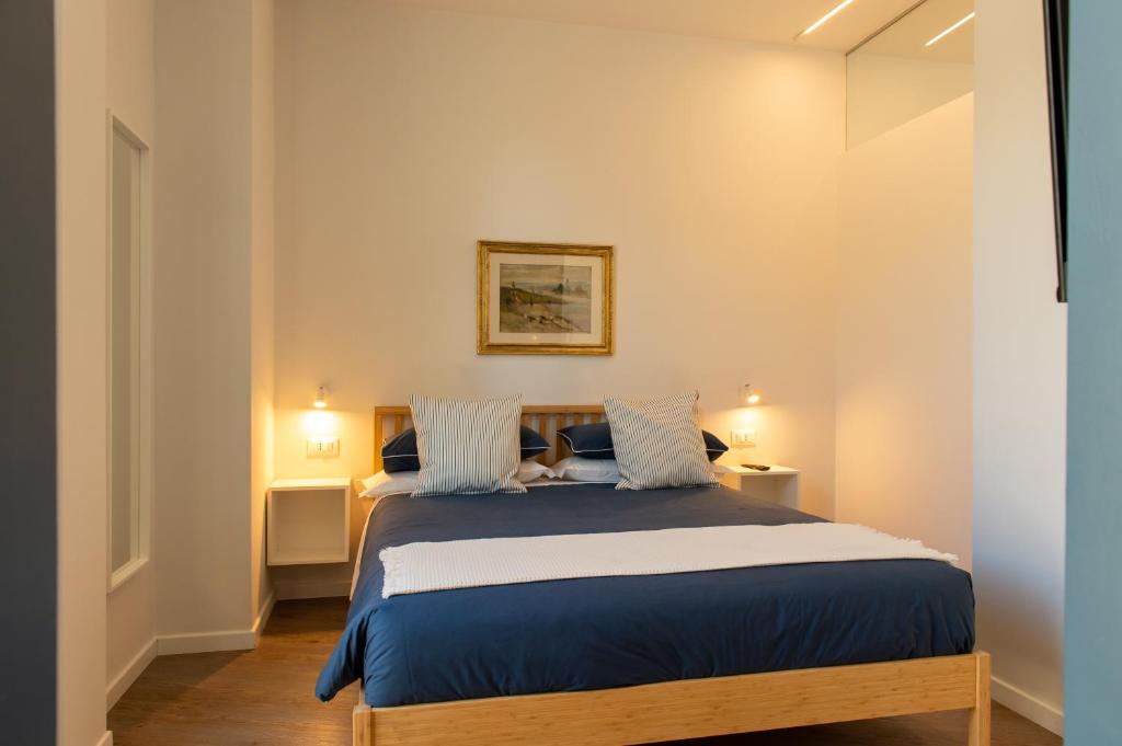 Postel nebo postele na pokoji v ubytování Smart & Urban Suites - Corso51