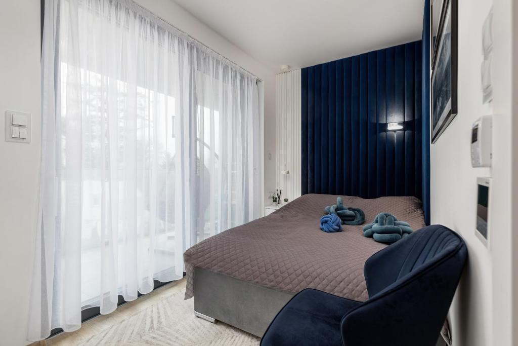 Łóżko lub łóżka w pokoju w obiekcie Holiday Exclusive