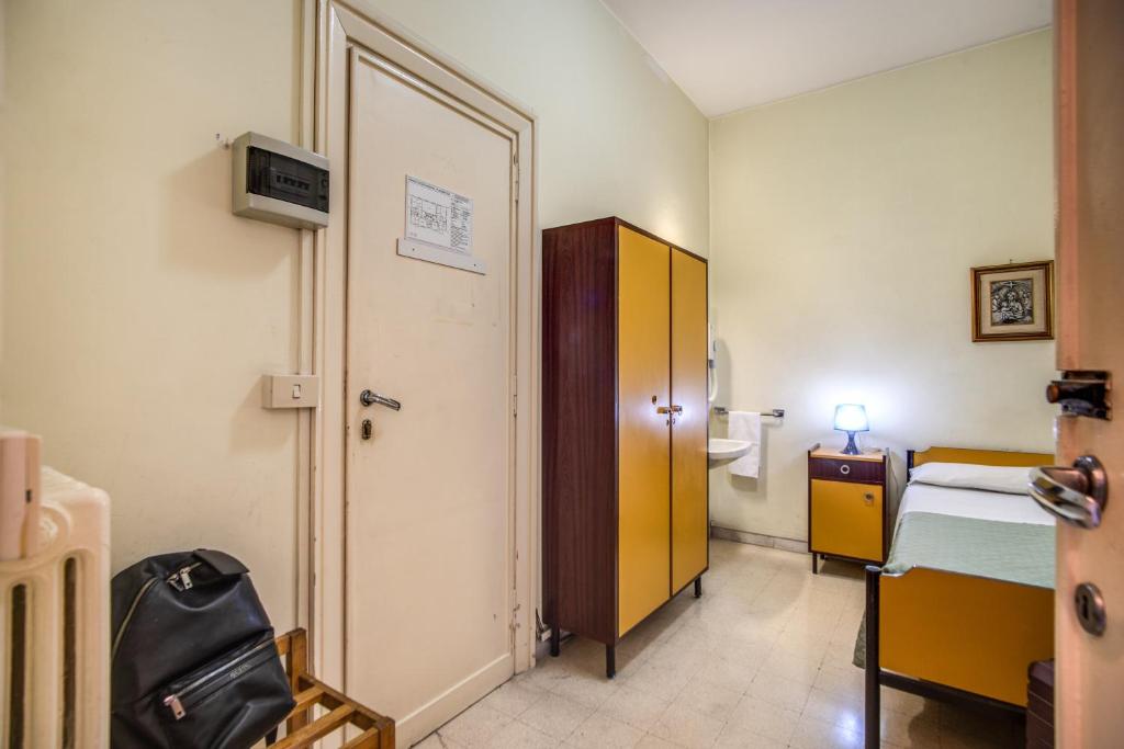 Łóżko lub łóżka w pokoju w obiekcie Casa per Ferie Ravasco San Pietro