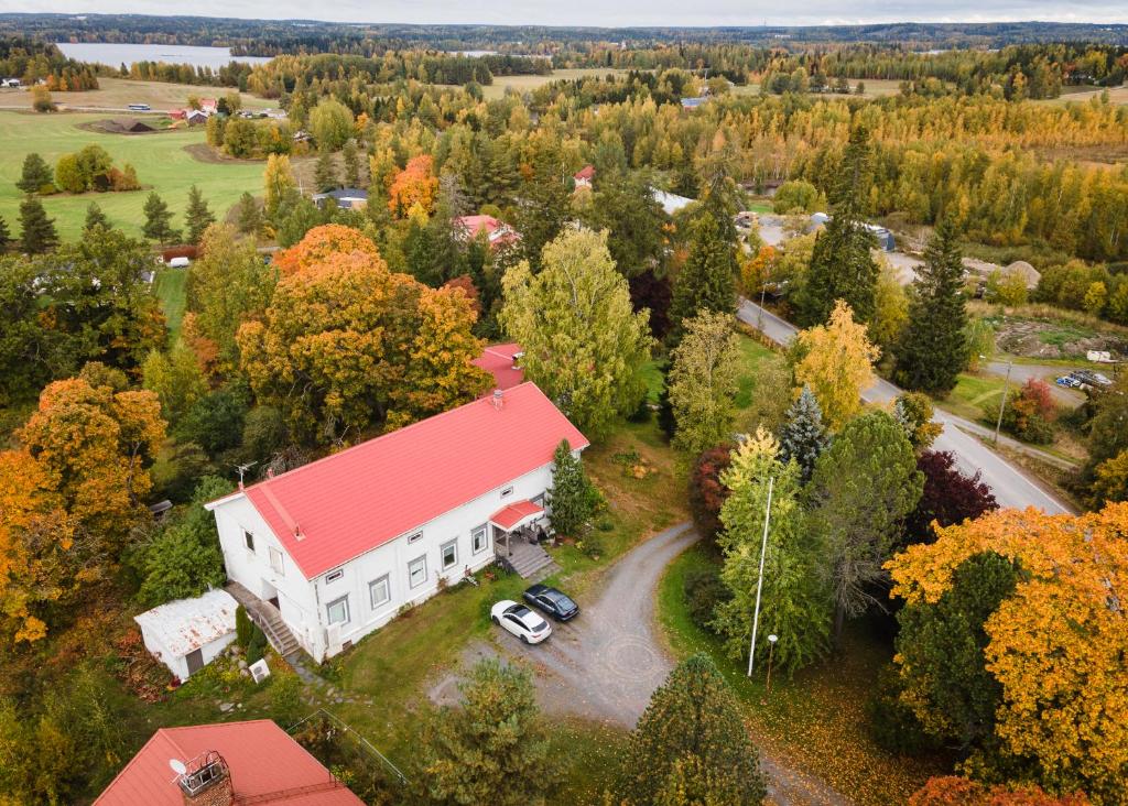 an aerial view of a white house with a red roof at Walkilan vanha kartano in Pirkkala