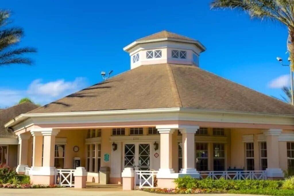 a large building with a tower on top of it at Veteran Owned 3bdr/3 bath Townhouse w/WiFi 3mi to Disney - Winter/Spring Specials in Kissimmee