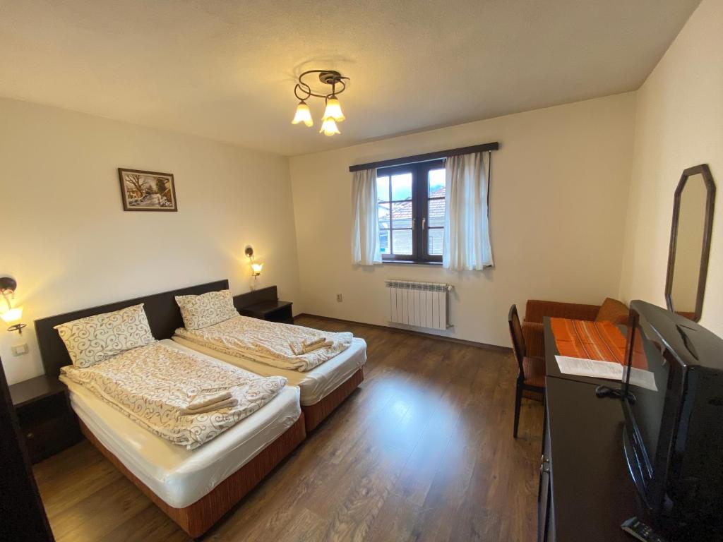 A bed or beds in a room at House Trivia
