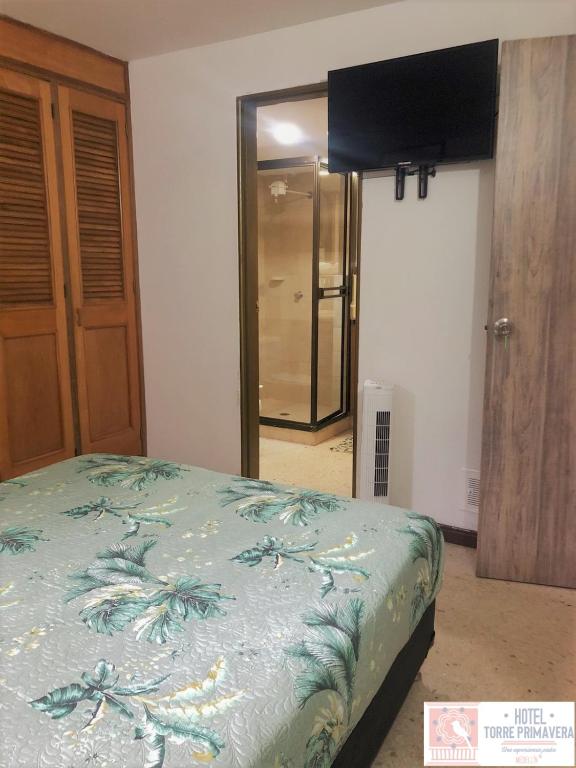 Postel nebo postele na pokoji v ubytování Hotel Torre Primavera