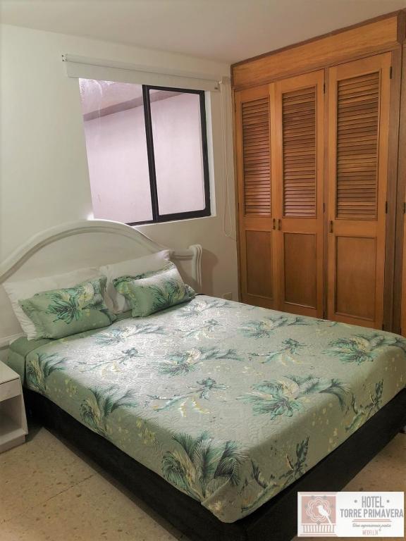 Postel nebo postele na pokoji v ubytování Hotel Torre Primavera