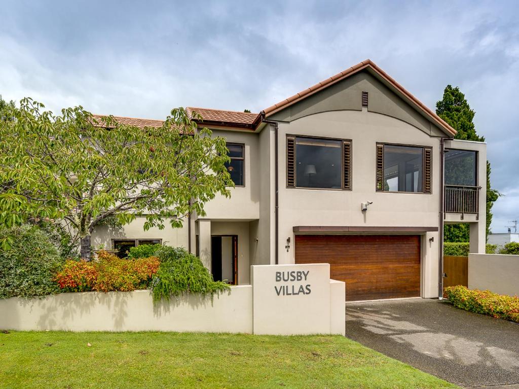a house with a sign that reads busy walls at Busby Hill Villa - Havelock North Holiday Home in Havelock North