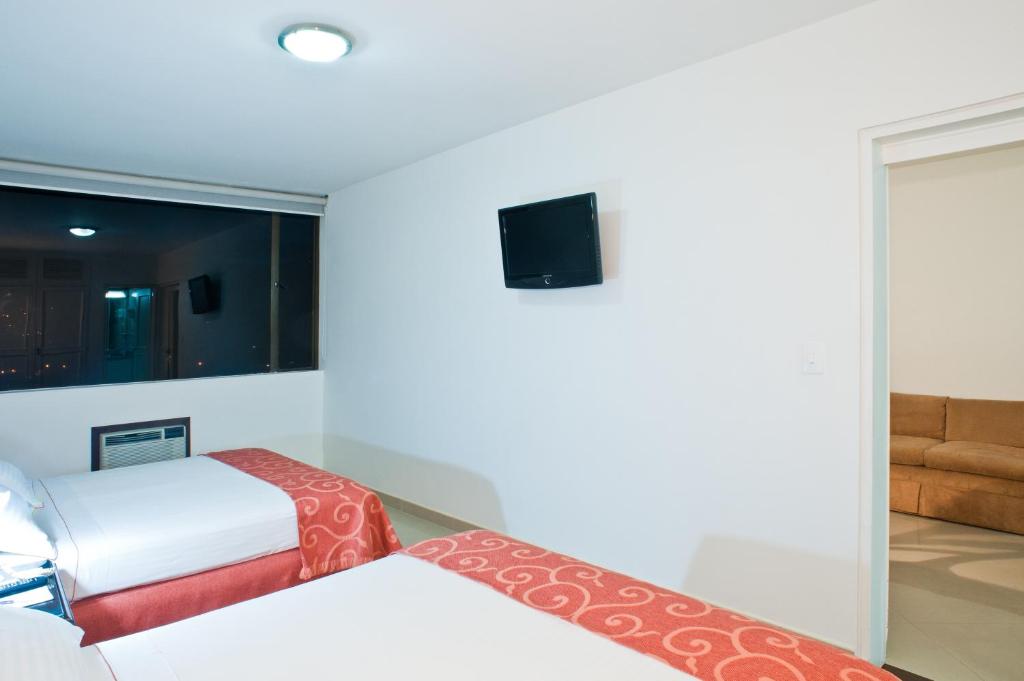 TV a/nebo společenská místnost v ubytování Hotel Dann Combeima