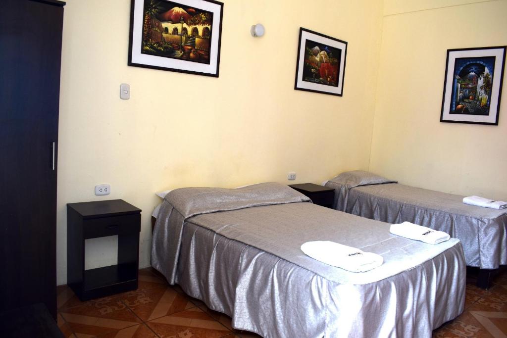 Postel nebo postele na pokoji v ubytování Mango Hostel B&B