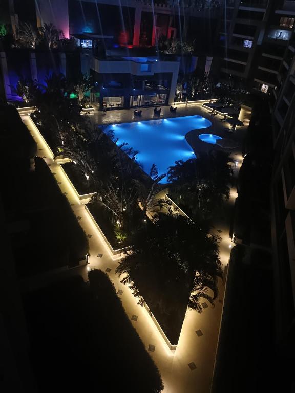 an overhead view of a swimming pool at night at Sheraton Ocean 704 - Without Pool access in Cairo