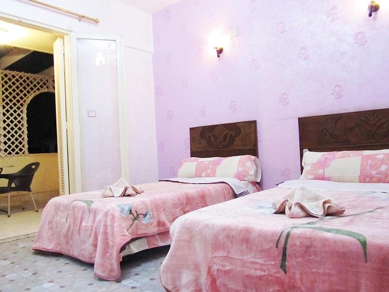 Postel nebo postele na pokoji v ubytování Cairo Moon Hostel