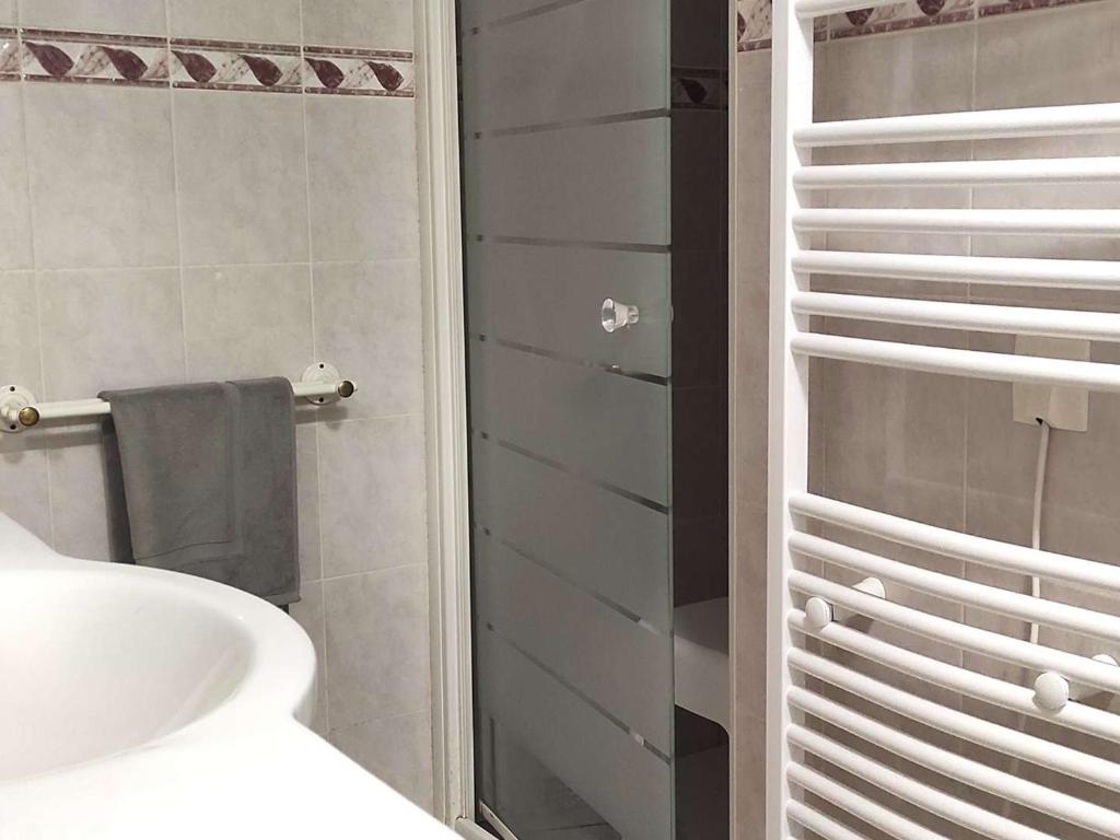 a bathroom with a toilet and a sink and a shower at Appartement Font-Romeu-Odeillo-Via, 3 pièces, 5 personnes - FR-1-580-84 in Font-Romeu-Odeillo-Via