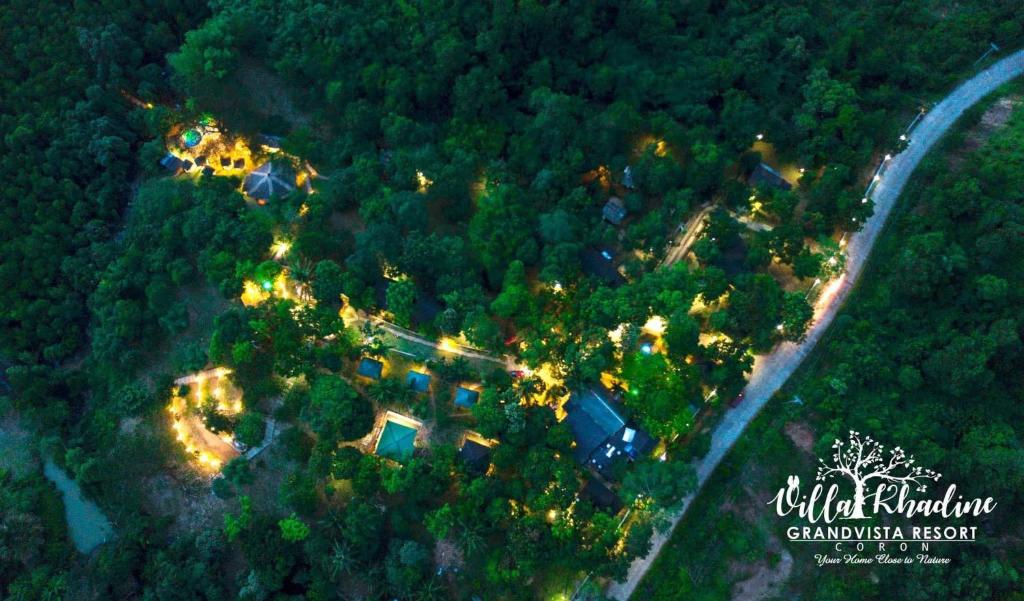 an aerial view of a house with lights in the trees at Villa Khadine Grand Vista Resort in Coron