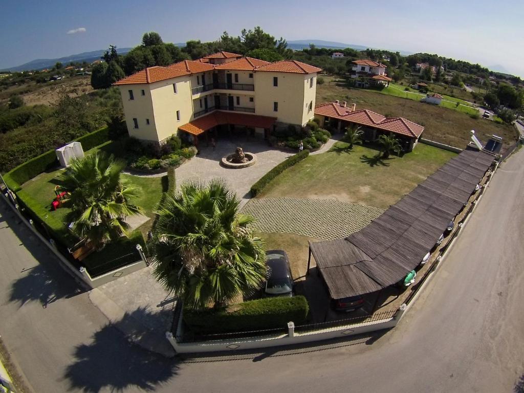 an aerial view of a large house with a driveway at Maistrali Apartments in Ormos Panagias