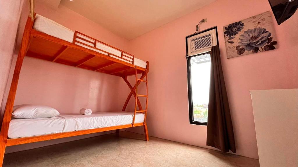 Postel nebo postele na pokoji v ubytování La Choeben Suites