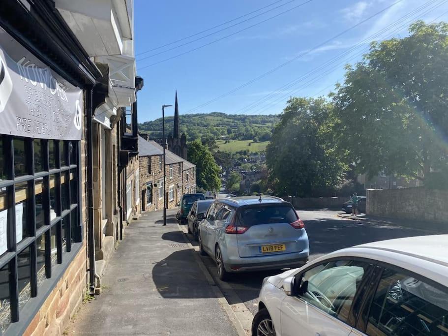 a row of cars parked on the side of a street at The studio (Hideaway) Dog friendly in Matlock