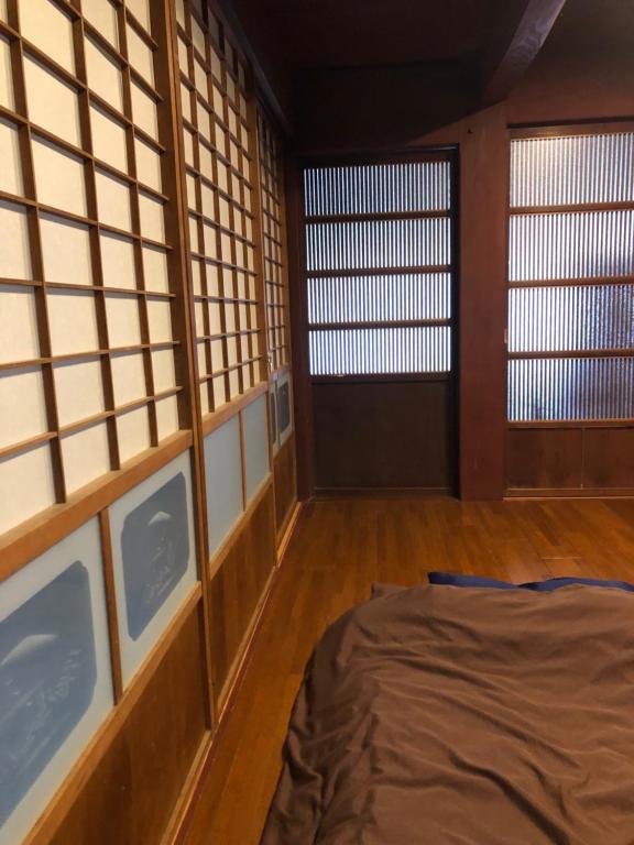 Postel nebo postele na pokoji v ubytování みなべゲストハウス