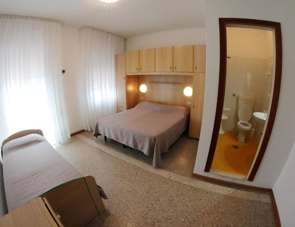 Postel nebo postele na pokoji v ubytování Albergo Rosa