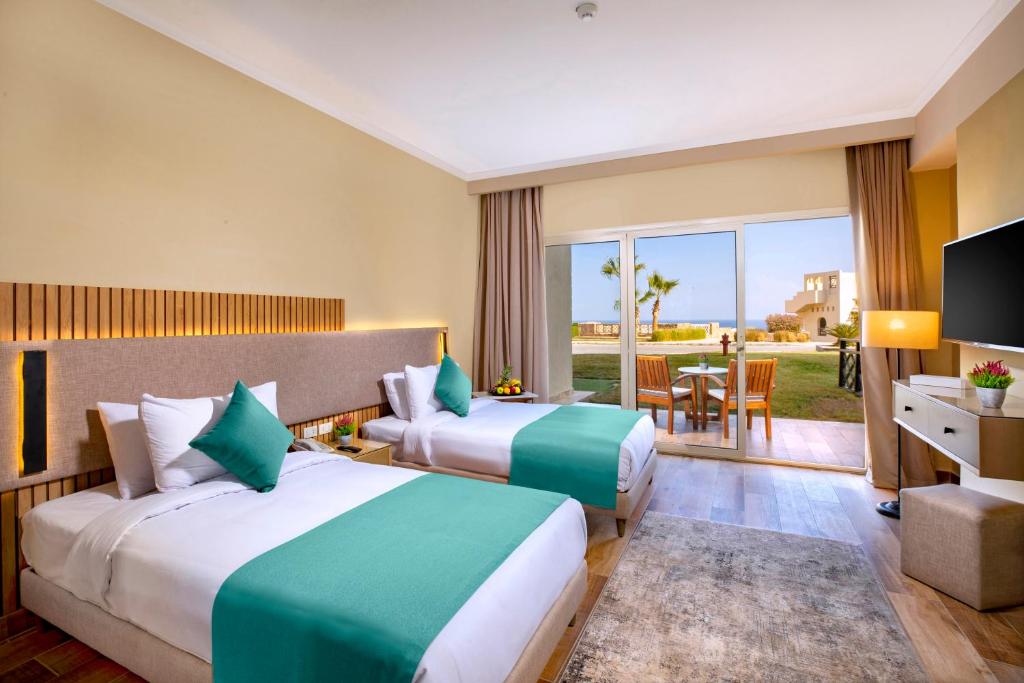 Кровать или кровати в номере Zen Resort Sahl Hasheesh by TBH Hotels