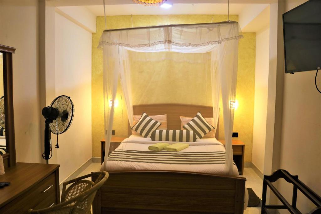 Postel nebo postele na pokoji v ubytování Hotel Ella`s Edge