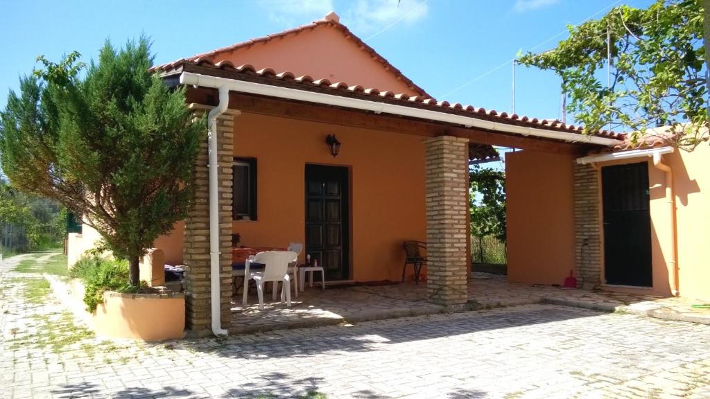 a small house with a patio at ARISTIDIS Apartments in Lefkimmi