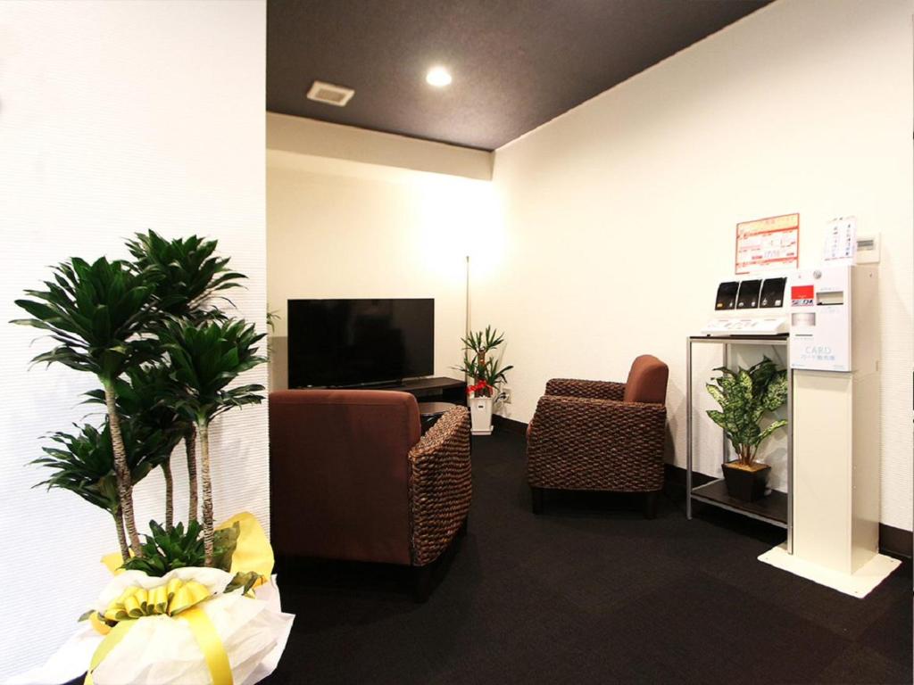 TV a/nebo společenská místnost v ubytování HOTEL LiVEMAX Kitafuchu
