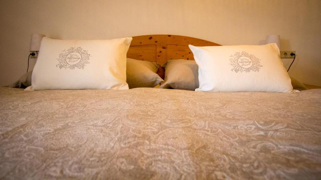 A bed or beds in a room at Gästehaus Dworschak