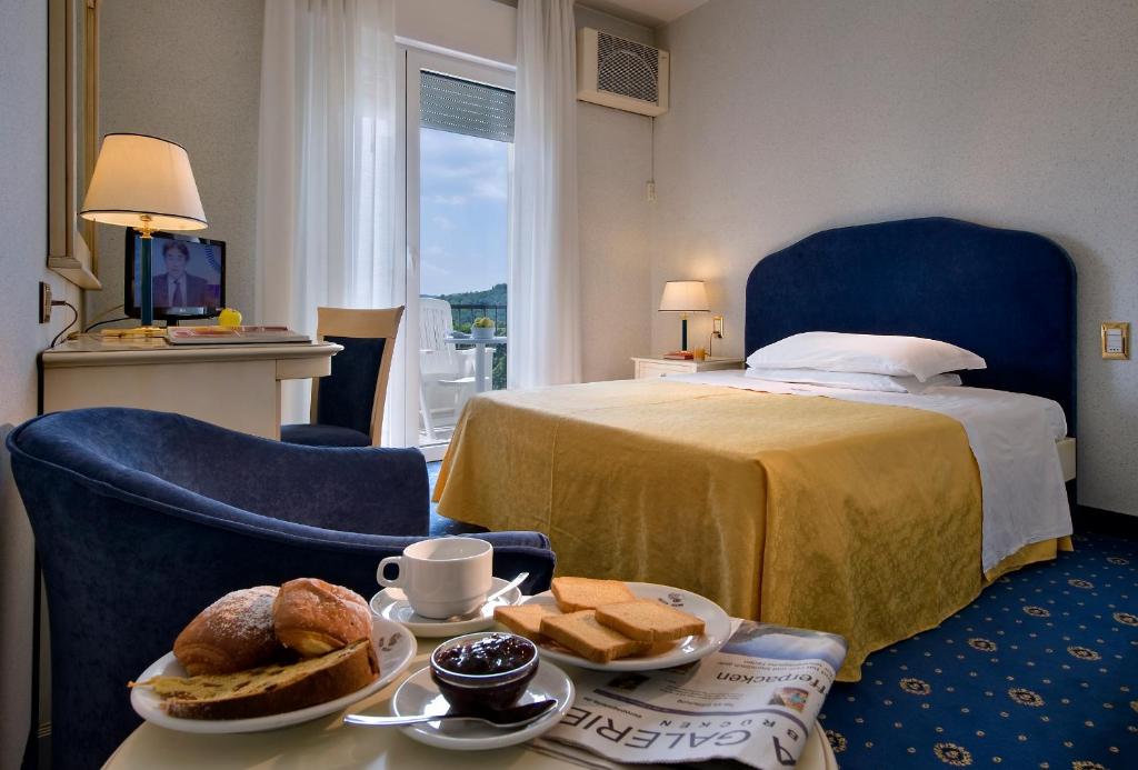 Postel nebo postele na pokoji v ubytování Hotel Ariston Molino Buja