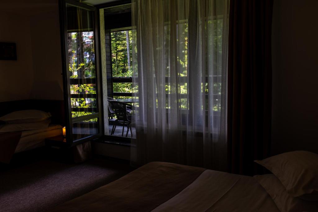 Postel nebo postele na pokoji v ubytování Hotel Smart