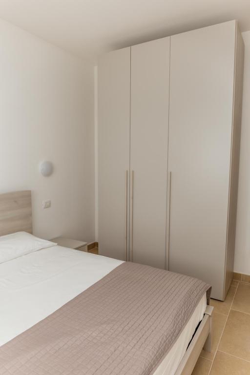 Łóżko lub łóżka w pokoju w obiekcie MareVasto - appartamento Vasto Marina