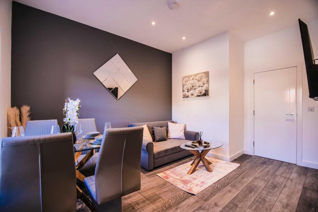 a living room with a couch and a table at Apartment 2 - The Crescent in York