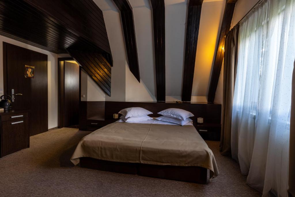 Postel nebo postele na pokoji v ubytování Hotel Smart