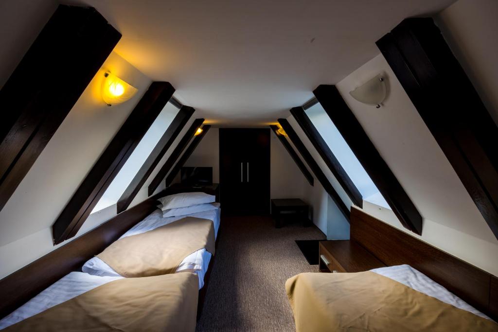 Postel nebo postele na pokoji v ubytování Hotel Smart