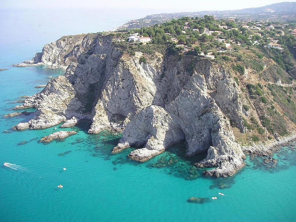 an aerial view of a rocky island in the ocean at Appartamento Vista Mare aA Briatico 15 Km Da Tropea Calabria in Briatico