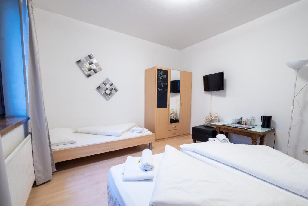 Postel nebo postele na pokoji v ubytování B&B Hotel Heimgartl