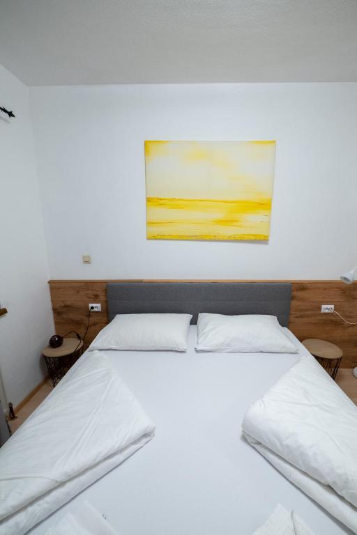 Postel nebo postele na pokoji v ubytování B&B Hotel Heimgartl