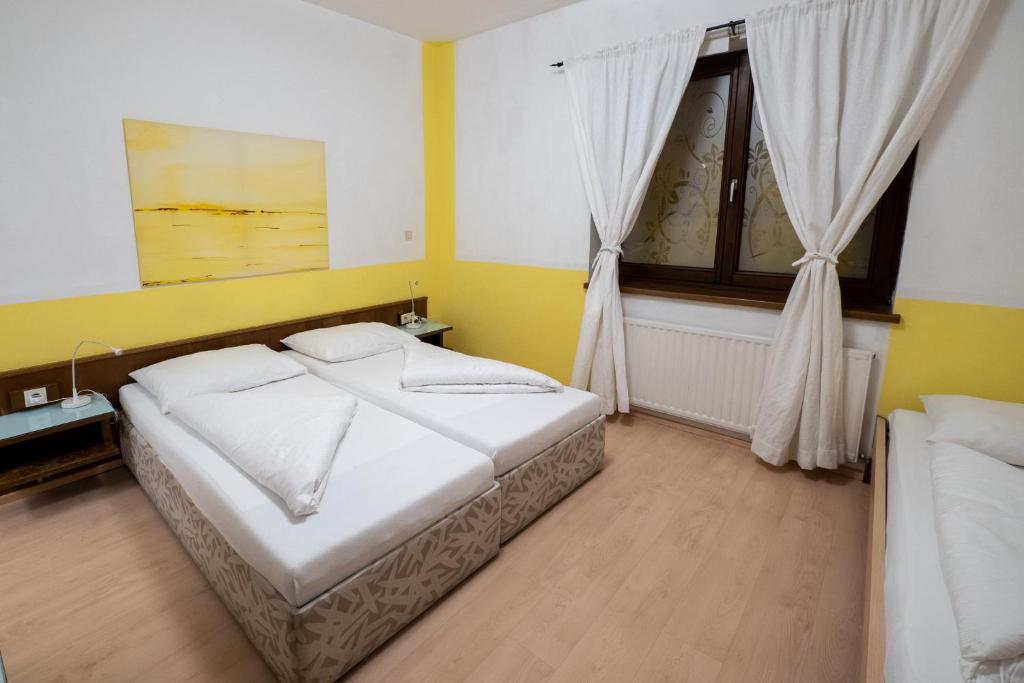 Postel nebo postele na pokoji v ubytování B&B Hotel Heimgartl