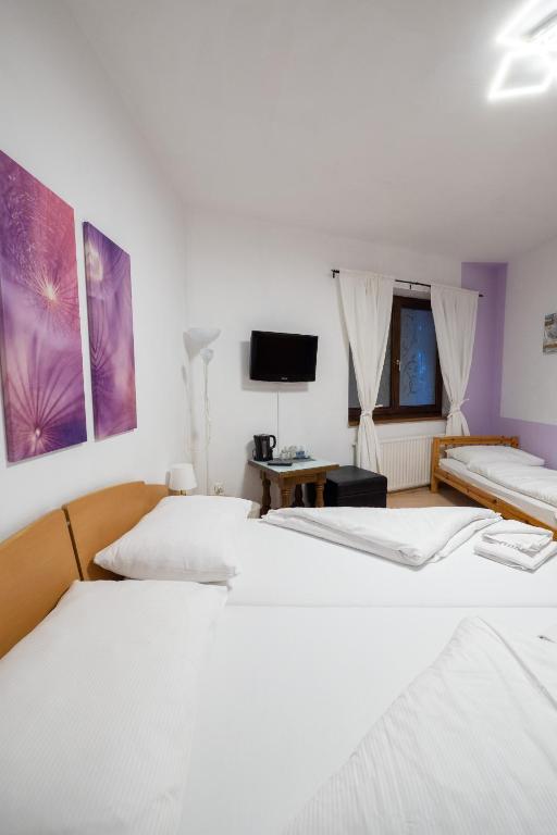 Postel nebo postele na pokoji v ubytování B&B Hotel Heimgartl