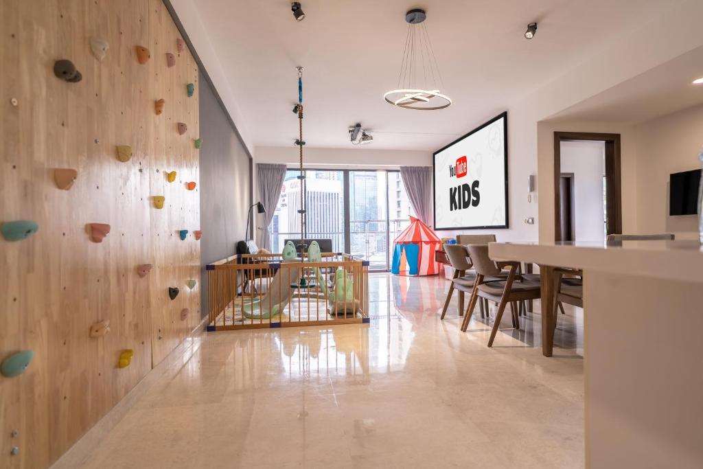 a large room with a large wooden wall at KL Top Location Kid's Theme White Collar Apartment in Kuala Lumpur