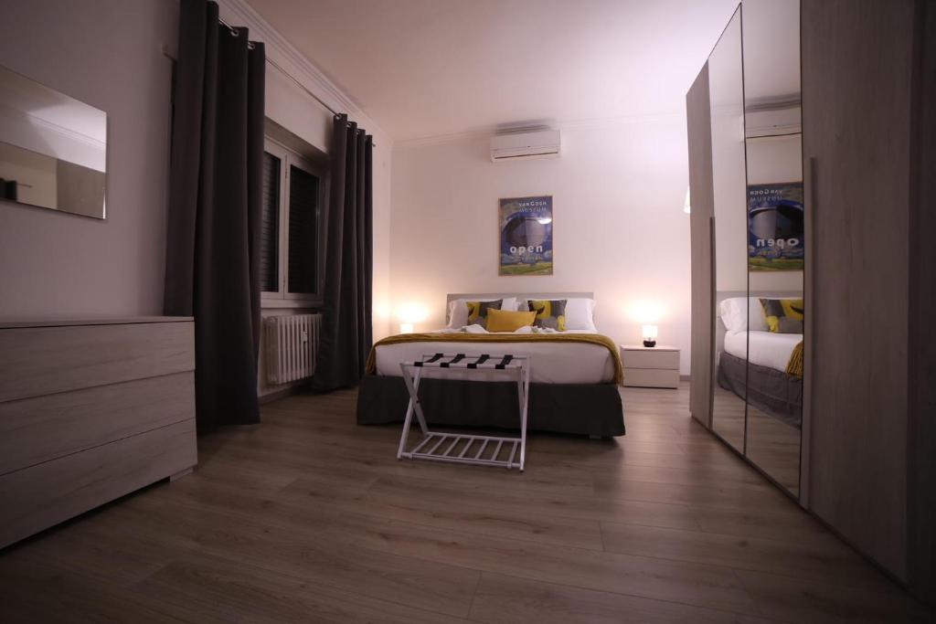A bed or beds in a room at Appia Antica Guest House