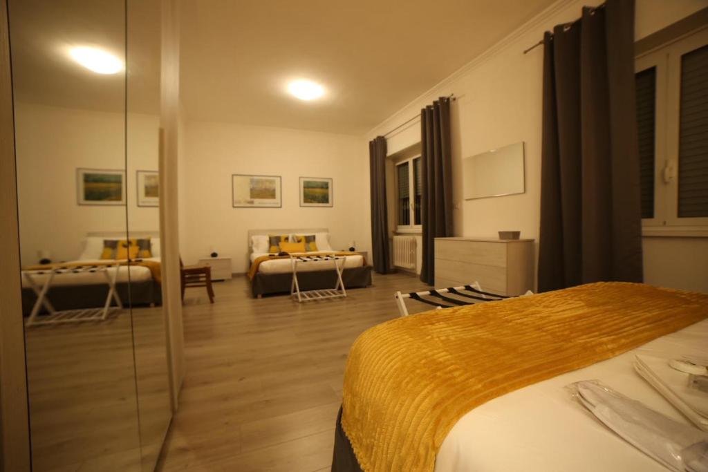 A bed or beds in a room at Appia Antica Guest House