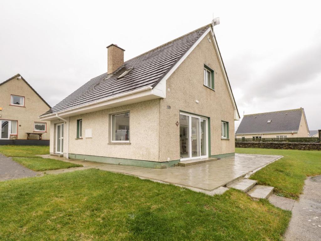 a house with a pitched roof at 38 Carrowhubbock Holiday Village in Enniscrone