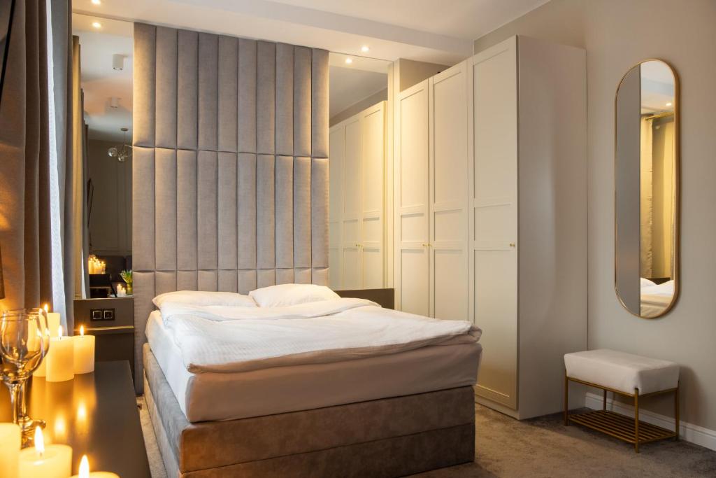 Кровать или кровати в номере Apartamenty Drewno i Ogień