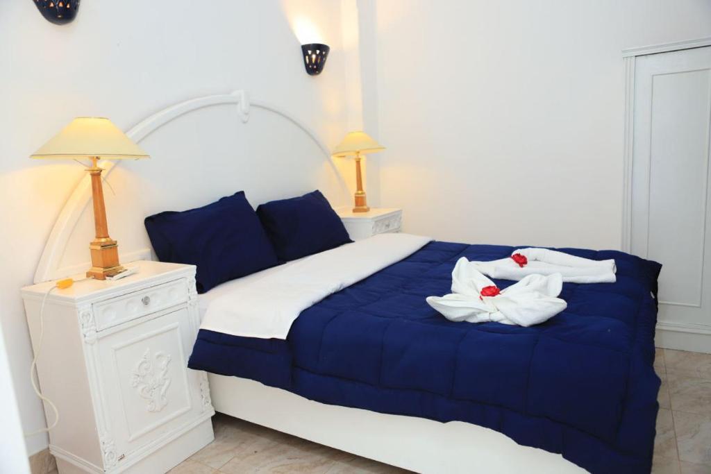Postel nebo postele na pokoji v ubytování Luxor Oasis Guest House
