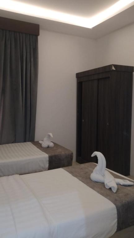 Postel nebo postele na pokoji v ubytování برج الجنوب جولدن نيو خميس مشيط