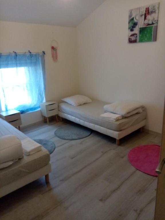 Posteľ alebo postele v izbe v ubytovaní Au p'tit bonheur