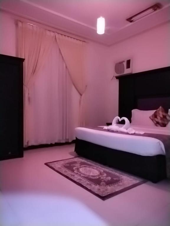 Postel nebo postele na pokoji v ubytování برج الجنوب جولدن نيو خميس مشيط