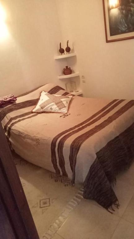 Postel nebo postele na pokoji v ubytování Riad Noor Charana